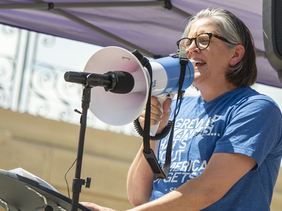 Christy Davis addresses the No Kings rally on June 14, 2025, from the south steps of the Statehouse in Topeka, where she announced she will explore a U.S. Senate run as a Democrat against incumbent Republican U.S. Sen. Roger Marshall.