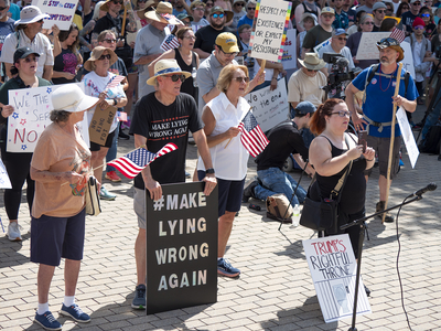 Kansans protest President Donald Trump at the June 14, 2025, "No Kings" rally at the Statehouse in Topeka.