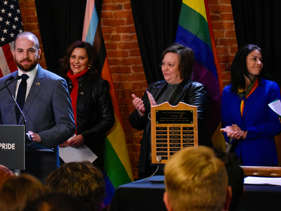 Whitmer signs LGBTQ+ non-discrimination bill into law alongside civil rights pioneer Mel Larsen