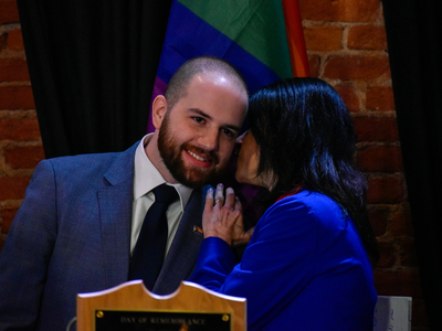 Whitmer signs LGBTQ+ non-discrimination bill into law alongside civil rights pioneer Mel Larsen