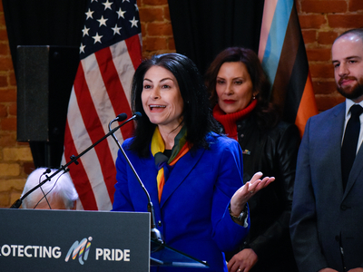 Whitmer signs LGBTQ+ non-discrimination bill into law alongside civil rights pioneer Mel Larsen