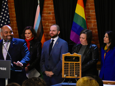 Whitmer signs LGBTQ+ non-discrimination bill into law alongside civil rights pioneer Mel Larsen