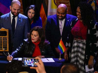 Whitmer signs LGBTQ+ non-discrimination bill into law alongside civil rights pioneer Mel Larsen