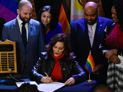 Whitmer signs LGBTQ+ non-discrimination bill into law alongside civil rights pioneer Mel Larsen