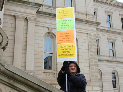 The People’s March draws hundreds to the Michigan Capitol before Trump’s inauguration