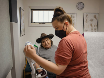 David Martinez gets his vitals checked at Mora clinic
