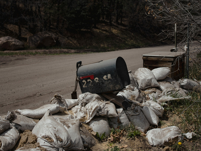 Mailbox propped up on sandbags at Erika Larsen and Tyler White's property