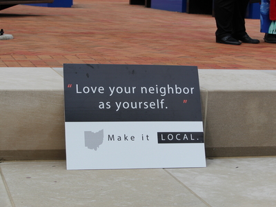 A sign at a rally for Haitians in Springfield, Ohio on June 25, 2026. (Photo by Megan Henry, Ohio Capital Journal).