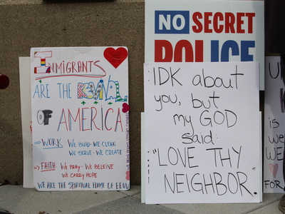 Signs at a rally for Haitians in Springfield, Ohio on June 25, 2026. (Photo by Megan Henry, Ohio Capital Journal).