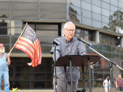 Carl Ruby, pastor of Springfield’s Central Christian Church, speaks at a rally for Haitians in Springfield, Ohio on June 25, 2026. (Photo by Megan Henry, Ohio Capital Journal).
