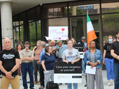People hold up signs at a rally for Haitians in Springfield, Ohio on June 25, 2026. (Photo by Megan Henry, Ohio Capital Journal).