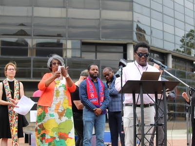 Biassu Pierre, a community organizer for Advocates for Basic Legal Equality, speaks at a rally for Haitians in Springfield, Ohio on June 25, 2026. (Photo by Megan Henry, Ohio Capital Journal).