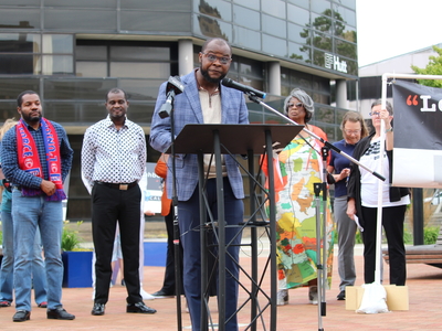 Viles Dorsainvil speaks at a rally for Haitians in Springfield, Ohio on June 25, 2026. He came to the United States from Haiti in 2020 and is the executive director of the Haitian Support Center in Springfield. (Photo by Megan Henry, Ohio Capital Journal).