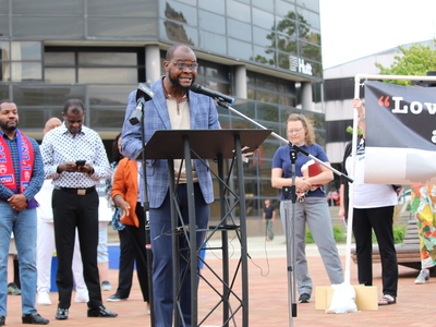 Viles Dorsainvil speaks at a rally for Haitians in Springfield, Ohio on June 25, 2026. He came to the United States from Haiti in 2020 and is the executive director of the Haitian Support Center in Springfield. (Photo by Megan Henry, Ohio Capital Journal).