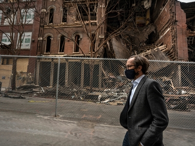 Metro Councilmember Freddie O'Connell walks down Second Avenue in Nashville, site of a Christmas Day bombing. (Photo: John Partipilo)