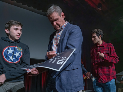 Alex Sharp gets his Bill Lee yard sign autographed by the governor on Nov. 7, 2022 in Franklin. (Photo: John Partipilo)