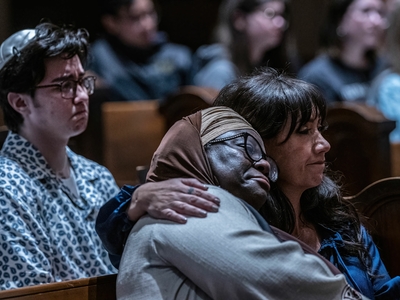 Metro Councilmember Zulfat Suara, left, leans on Maura Lee Albert during the March 27 vigil. (Photo: John Partipilo)
