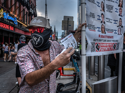 A member of the white nationalist hate group Goyim Defense League attempts to hand out flyers in downtown Nashville on Sunday, July 14. (Photo: John Partipilo)