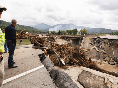 Gov. Bill Lee views damage at an East Tennessee bridge destroyed by flooding from Hurricane Helene. (Photo: Brandon Hull/Office of the Governor)