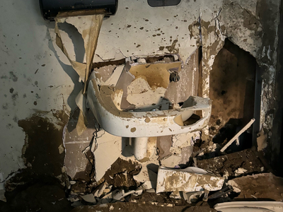 Unicoi County Hospital in Erwin, Tennessee, was destroyed by a flash flood during Hurricane Helene in late September. During the worst of the flooding, murky, brown rapids surrounded the hospital building, with 12 feet of water on all sides. Ballad Health CEO Alan Levine estimated it will cost $50 million to replace the hospital. (Lauren Sausser/KFF Health News)