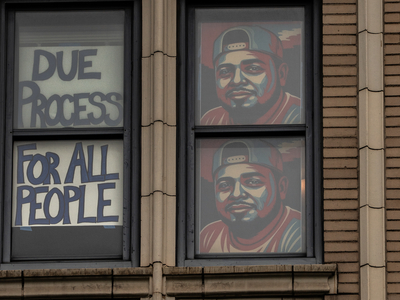 Signs supporting Kilmar Abrego Garcia paper the windows of a Downtown Nashville office building. (Photo: John Partipilo/Tennessee Lookout)