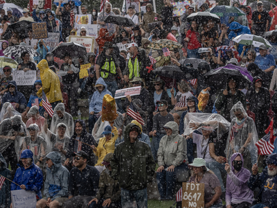 Rain pours on thousands of protesters who were in Nashville's Bicentennial Mall to protest President Donald Trump. (Photo: John Partipilo/Tennessee Lookout)