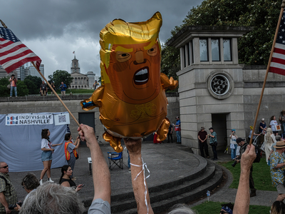 Balloons depicted President Donald Trump were lofted into the air in Nashville on June 14, 2025, at a protest rally. (Photo: John Partipilo/Tennessee Lookout)