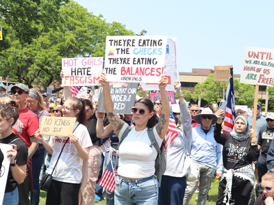Protesters gather in Milwaukee's Cathedral Square to march and rally as part of the No Kings Day protests nationwide. (Photo by Isiah Holmes/Wisconsin Examiner)