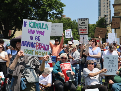 Protesters gather in Milwaukee's Cathedral Square to march and rally as part of the No Kings Day protests nationwide. (Photo by Isiah Holmes/Wisconsin Examiner)