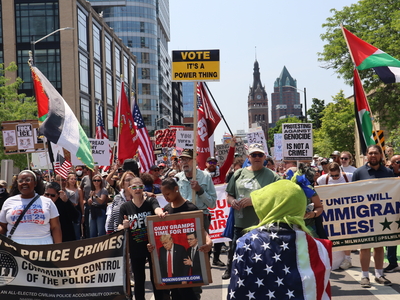 Protesters gather in Milwaukee's Cathedral Square to march and rally as part of the No Kings Day protests nationwide. (Photo by Isiah Holmes/Wisconsin Examiner)