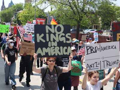 Protesters gather in Milwaukee's Cathedral Square to march and rally as part of the No Kings Day protests nationwide. (Photo by Isiah Holmes/Wisconsin Examiner)