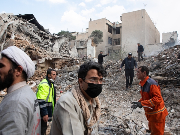 Emergency crews work at the site of a US-Israeli strike on a residential building that also destroyed the adjacent Rafi-Nia Synagogue on April 7, 2026, in Tehran, Iran. (Photo by Majid Saeedi/Getty Images)