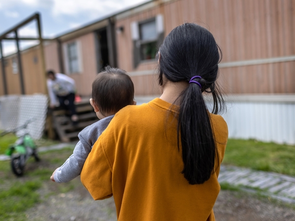 SELLERSBURG, INDIANA - APRIL 25: Honduran immigrant Nani, 10, carries her baby cousin after moving in with her extended family on April 25, 2021 in Sellersburg, Indiana. She had been released two days before from U.S. Health and Human Services (HHS) custody as an unaccompanied minor after spending nearly eight weeks in shelters, the last one in New York City. Originally Nani had traveled with her mother from Honduras and crossed the Rio Grande from Mexico together, but they were immediately deported under T