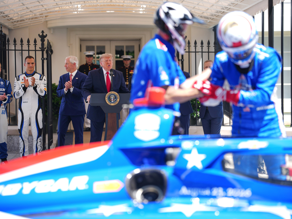 President Donald Trump speaks as (L-R) 2026 Indianapolis 500 winner Felix Rosenqvist, reigning IndyCar series champion Alex Palou and Freedom 250 Grand Prix Chairman Bud Denker look on at a Freedom 250 Grand Prix showcase on West Executive Avenue between the West Wing of the White House and the Eisenhower Executive Office Building on July 13, 2026 in Washington, DC. The IndyCar Freedom 250 Grand Prix car race, August 22 and 23 on the National Mall, is part of America's 250th anniversary celebrations. (Photo