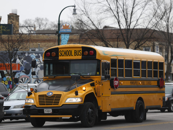 A school bus stops at the intersection of West Lake Street and South Lyndale Avenue on Thursday, Jan. 9, 2025, in Minneapolis, Minn. (Ellen Schmidt/Minnesota Reformer)