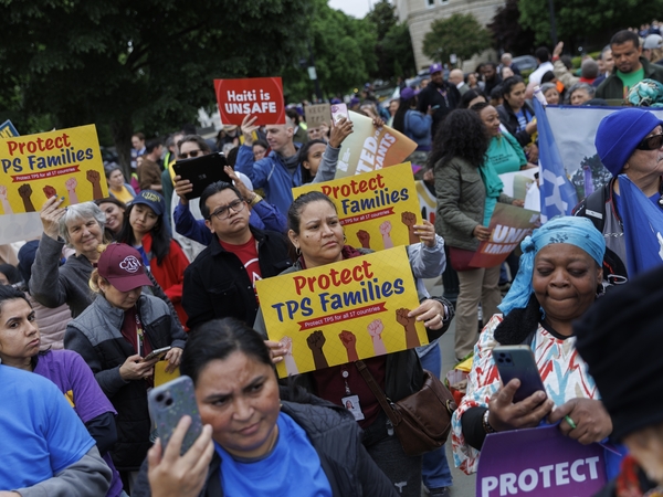 Demonstrators chant and hold signs outside U.S. Supreme Court on April 29, 2026 in Washington, D.C. The court heard arguments challenging the termination of Temporary Protected Status for immigrants. (Photo by Tom Brenner/Getty Images)