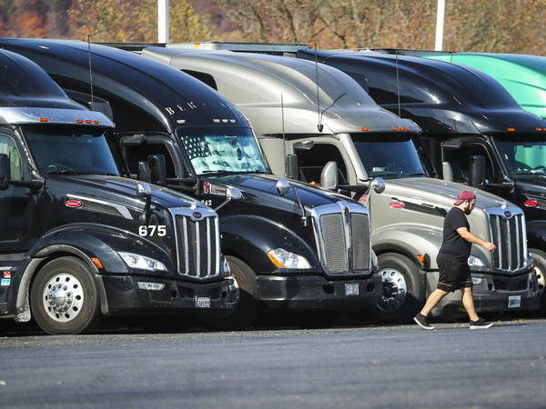 Tractor trailers sit parked in a row at a truck stop in Bloomsbury, N.J. (Dana DiFilippo | New Jersey Monitor)