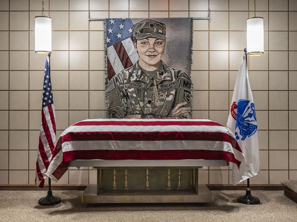 A federal judge will allow the Department of Justice to begin force-feeding the man charged with the shooting last November of Army Spc. Sarah Beckstrom, a member of the West Virginia National Guard. Beckstrom's casket is displayed at a funeral home in her hometown of Webster Springs, West Virginia, on Dec. 5, 2025. (Photo courtesy of the Department of Defense)