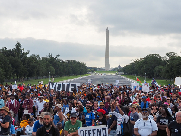 Demonstrators gathered at the Lincoln Memorial Reflecting Pool for an event in Washington, D.C., on Friday, Aug. 28, 2026, marking the 63rd anniversary of the March on Washington for Jobs and Freedom where the late civil rights leader Rev. Martin Luther King Jr. delivered his "I Have a Dream" speech. (Photo by Ashley Murray/States Newsroom)