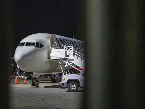 An airplane sits on the tarmac at Mesa Gateway Airport on the evening of April 9, 2026, outside of the Arizona Removal Operations Coordination Center, an ICE facility where detainees are temporarily housed before they are put on a plane to either be deported or moved to a different ICE facility. (Photo by Jerod MacDonald-Evoy/Arizona Mirror)