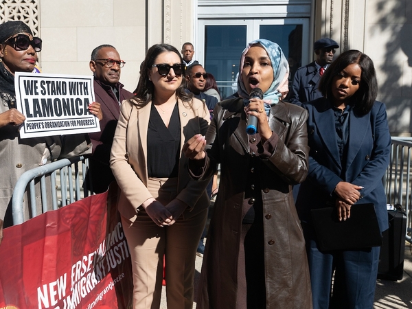 Democratic U.S. Rep. Ilhan Omar of Minnesota speaks during a rally in support of Rep. LaMonica McIver, D-N.J., outside a federal courthouse in Newark, New Jersey, on Oct. 21, 2025. She is flanked by Democratic Reps. Sara Jacobs of California, left, and Jasmine Crockett of Texas, right. (Photo by Reena Rose Sibayan/New Jersey Monitor)