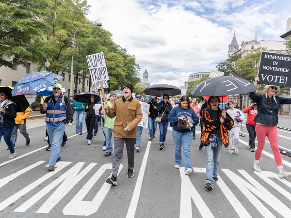 Participants in a No Kings day event march toward the U.S. Capitol in Washington, D.C., on Oct. 17, 2026. The Umbrella Walk 4 Change was one of thousands of No Kings events across the nation encouraging early voting. (Photo by Baya Burgess/States Newsroom)