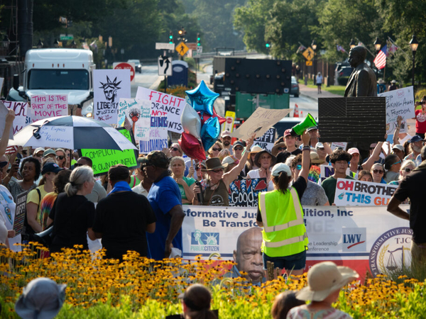 Hundreds bring ‘good trouble’ rally to State House steps