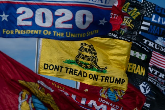 Campaign rally flags for former President Donald Trump. (Photo by Elijah Nouvelage/Getty Images)