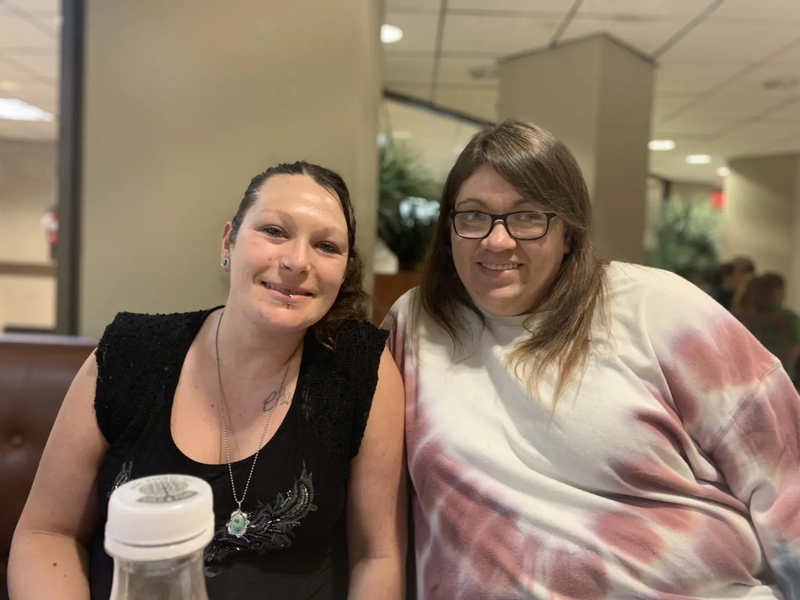 Ashley Omps (left) and Malissa Rose sit in the WV Capitol Food Court. Photo by Ellie Heffernan.