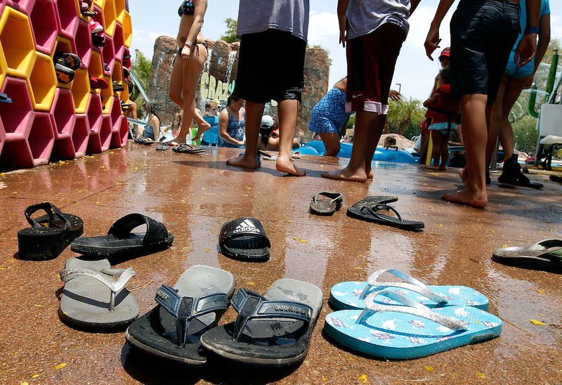 People in Phoenix seek relief from boiling temperatures at the Wet-N-Wild Water Park. Regulators say the western United States is at an elevated risk for seeing some shortages of electricity this summer as above normal temperatures are expected. (Photo by Ralph Freso/Getty Images)