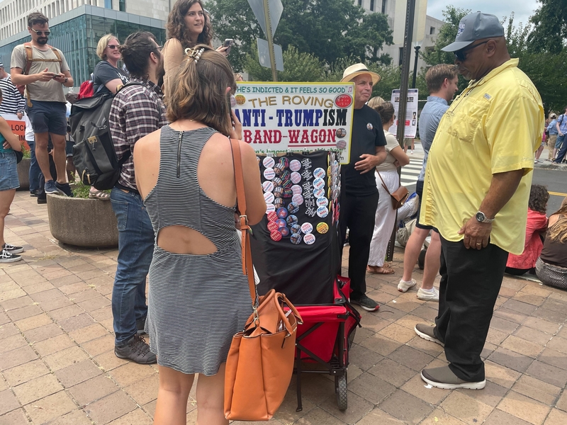 A vendor sells anti-Trump souvenirs outside the courthouse where former President Donald Trump was arraigned on federal charges on Aug. 3, 2023. (Ariana Figueroa/States Newsroom)