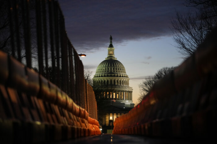 A view of the U.S. Capitol down East Capitol Street at sunset on Jan. 5, 2022 in Washington, D.C. A recent report by the good-government group Issue One found that 160 chief local election officials in 11 Western states — around 40% of all chief local election officials in those states — have left their jobs since November 2020.&nbsp;(Photo by Drew Angerer/Getty Images)