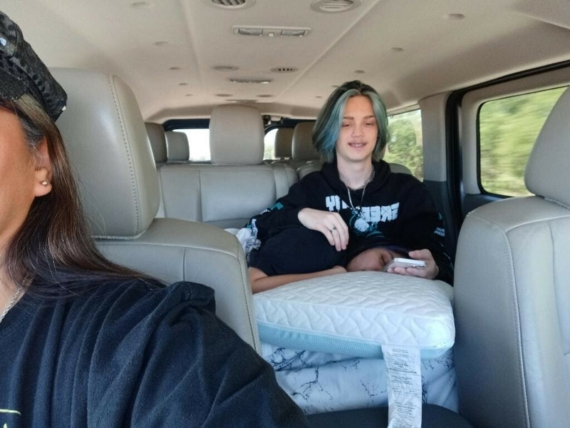 DakotaRei Frausto and their boyfriend, Tanner McCallum, in the back seat of a car following an abortion procedure. Frausto drove 11 hours each way over the course of two days from San Antonio, Texas, to a clinic in New Mexico after abortion was banned in Texas at six weeks of pregnancy. (Courtesy of DakotaRei Frausto)
