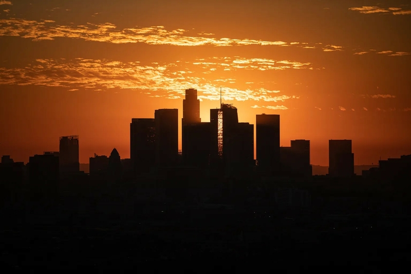 View of downtown Los Angeles from Ascot Park during sunset on Nov. 18, 2022. Photo by Larry Valenzuela for CalMatters/CatchLight Local